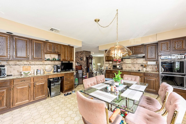 34 Cedar Rock Rd, Woodbridge, CT 06525 - kitchen with double oven, a chandelier, tasteful backsplash, open shelves, and under cabinet range hood