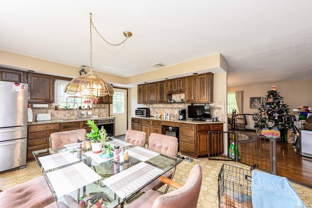 34 Cedar Rock Rd, Woodbridge, CT 06525 - dining space featuring a chandelier