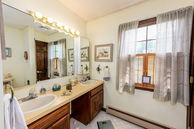 34 Cedar Rock Rd, Woodbridge, CT 06525 - full bath featuring a baseboard radiator, healthy amount of natural light, double vanity, and baseboards