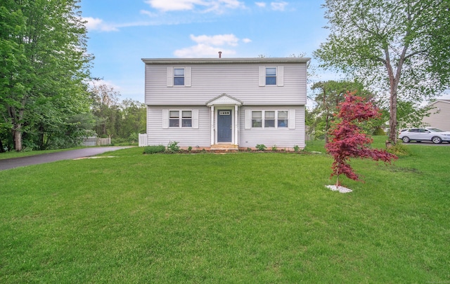 227 Thistle Ln, Southington, CT 06489 - colonial house with a front lawn and asphalt driveway