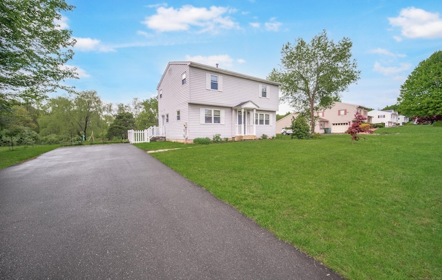 227 Thistle Ln, Southington, CT 06489 - view of front facade with driveway and a front yard