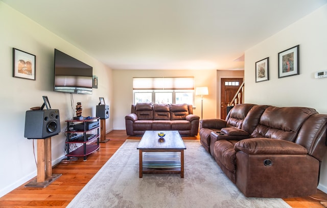 227 Thistle Ln, Southington, CT 06489 - living room featuring wood finished floors, stairs, and baseboards