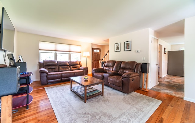227 Thistle Ln, Southington, CT 06489 - living room featuring wood finished floors and stairway
