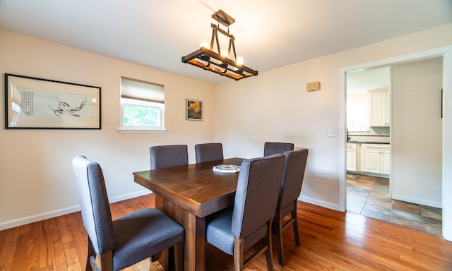 227 Thistle Ln, Southington, CT 06489 - dining space with baseboards, wood finished floors, and a chandelier