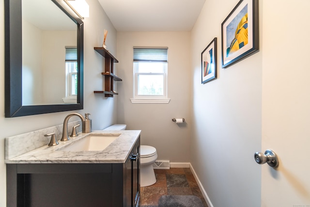 227 Thistle Ln, Southington, CT 06489 - bathroom with toilet, stone tile flooring, vanity, and baseboards