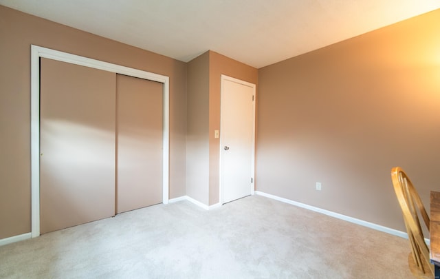 227 Thistle Ln, Southington, CT 06489 - unfurnished bedroom with light colored carpet, baseboards, and a closet