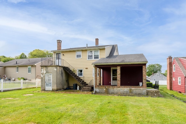 24 Goff St, Waterbury, CT 06704 - rear view of property with stairway and a chimney
