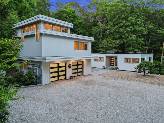 99 High Ridge Rd, Pound Ridge, NY 10576 - contemporary home featuring driveway and a garage