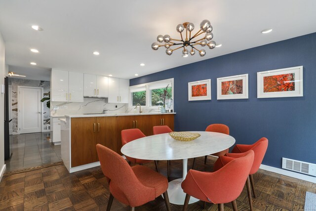 99 High Ridge Rd, Pound Ridge, NY 10576 - dining room with recessed lighting, a chandelier, and baseboards