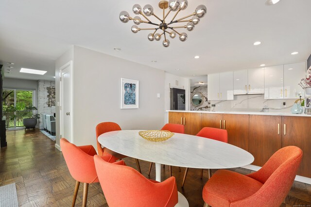99 High Ridge Rd, Pound Ridge, NY 10576 - dining space with a chandelier and recessed lighting