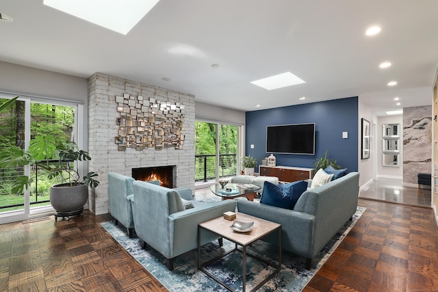 99 High Ridge Rd, Pound Ridge, NY 10576 - living room with a skylight, plenty of natural light, a brick fireplace, recessed lighting, and baseboards