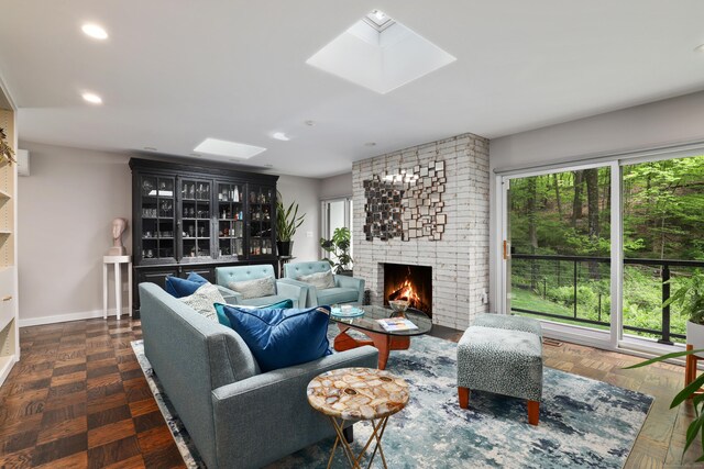 99 High Ridge Rd, Pound Ridge, NY 10576 - living room featuring a skylight, a fireplace, baseboards, and recessed lighting