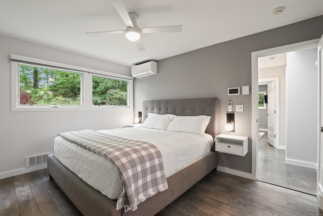 99 High Ridge Rd, Pound Ridge, NY 10576 - bedroom featuring multiple windows, a wall unit AC, dark wood-style floors, and baseboards