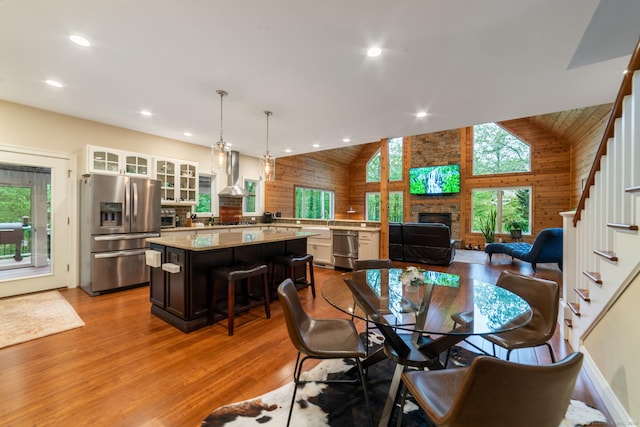 732 Hulls Hill Rd, Southbury, CT 06488 - dining area with healthy amount of natural light, stairway, wood finished floors, high vaulted ceiling, and recessed lighting