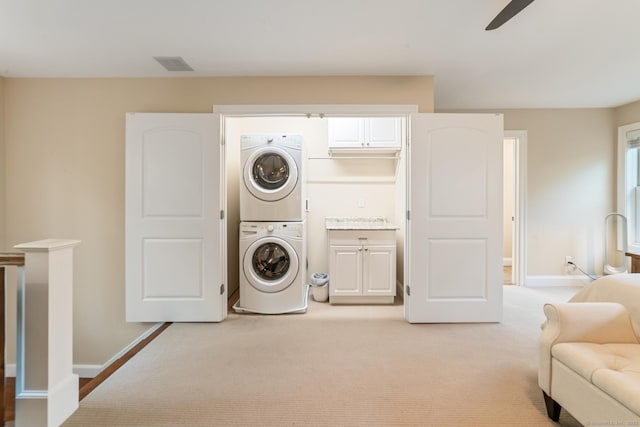 732 Hulls Hill Rd, Southbury, CT 06488 - washroom featuring estacked washer and dryer, a ceiling fan, baseboards, and light carpet