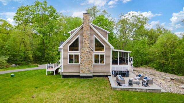 732 Hulls Hill Rd, Southbury, CT 06488 - rear view of property featuring a patio, a yard, a chimney, a sunroom, and stairway