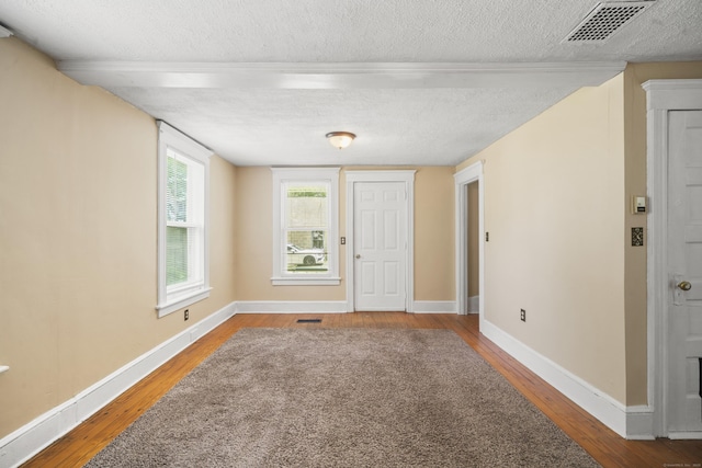 245 Riverside Ave, Torrington, CT 06790 - foyer featuring wood finished floors, a textured ceiling, and baseboards