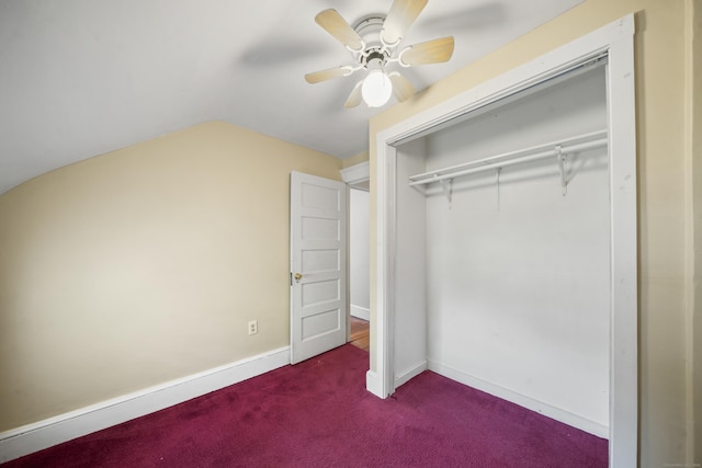 245 Riverside Ave, Torrington, CT 06790 - unfurnished bedroom with dark carpet, lofted ceiling, a closet, a ceiling fan, and baseboards
