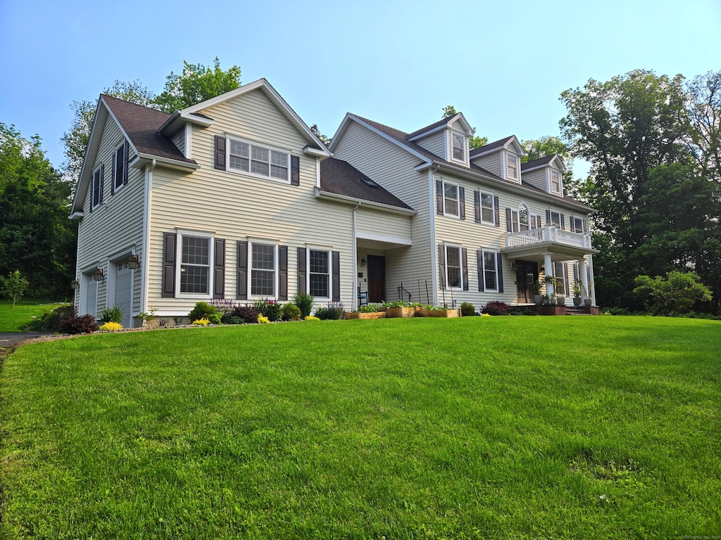 22 Woodbine Rd, Woodbridge, CT 06525 - colonial inspired home with a front lawn and an attached garage