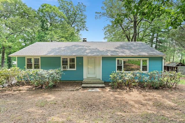33 Deer Park Rd, Simsbury, CT 06089 - view of front facade with a shingled roof and a chimney