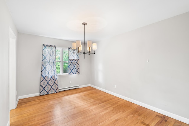 33 Deer Park Rd, Simsbury, CT 06089 - unfurnished room featuring a baseboard heating unit, a chandelier, light wood-style flooring, and baseboards