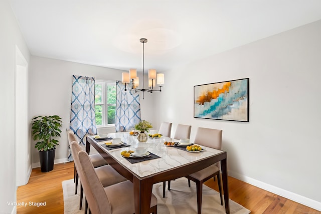 33 Deer Park Rd, Simsbury, CT 06089 - dining space featuring a chandelier, light wood finished floors, and baseboards