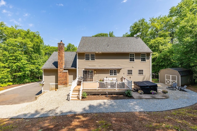 1382 Cedar Swamp Rd, Coventry, CT 06238 - back of property featuring a wooden deck, a chimney, and roof with shingles