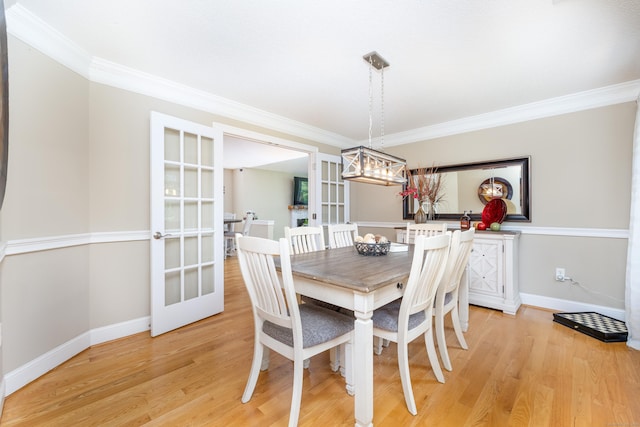 1382 Cedar Swamp Rd, Coventry, CT 06238 - dining space featuring crown molding, light wood-style flooring, baseboards, and french doors