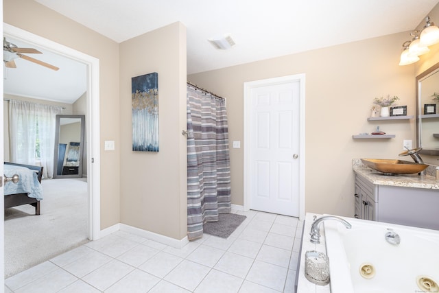 1382 Cedar Swamp Rd, Coventry, CT 06238 - ensuite bathroom featuring vanity, ceiling fan, a jetted tub, and tile patterned flooring