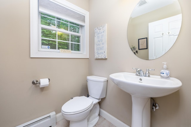 1382 Cedar Swamp Rd, Coventry, CT 06238 - bathroom featuring a baseboard heating unit, baseboards, toilet, and tile patterned flooring