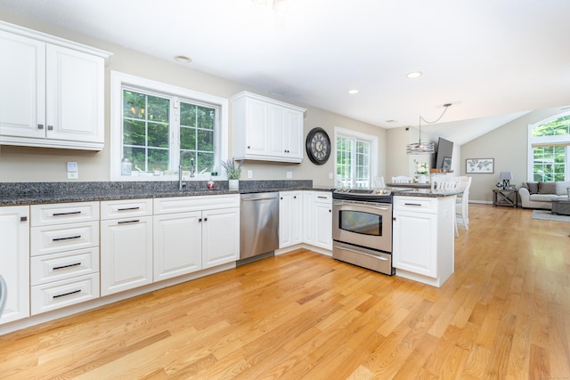 1382 Cedar Swamp Rd, Coventry, CT 06238 - kitchen featuring stainless steel appliances, light wood-style flooring, a sink, open floor plan, and white cabinets