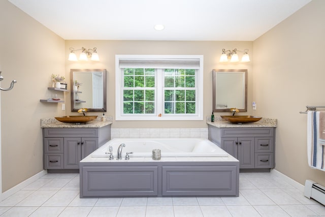 1382 Cedar Swamp Rd, Coventry, CT 06238 - bathroom with a baseboard heating unit, two vanities, a garden tub, tile patterned flooring, and recessed lighting