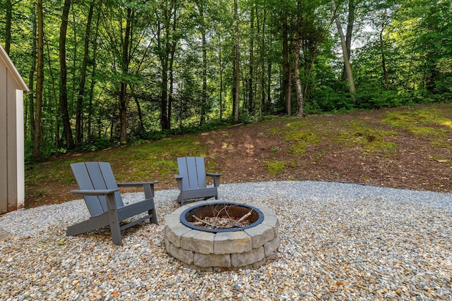 1382 Cedar Swamp Rd, Coventry, CT 06238 - view of patio / terrace featuring a fire pit and a view of trees