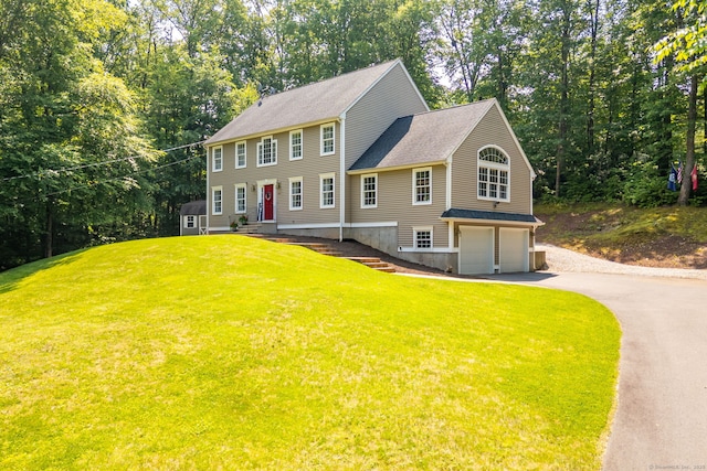 1382 Cedar Swamp Rd, Coventry, CT 06238 - colonial house with a garage, driveway, a front lawn, a shingled roof, and view of scattered trees
