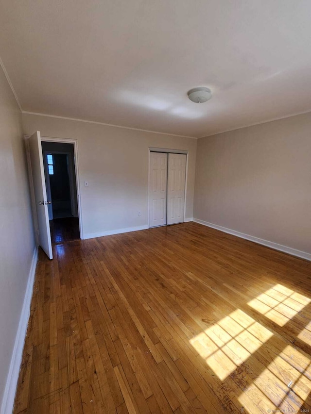 275 Texas Ave Unit D, Bridgeport, CT 06610 - unfurnished room featuring wood-type flooring, baseboards, and crown molding