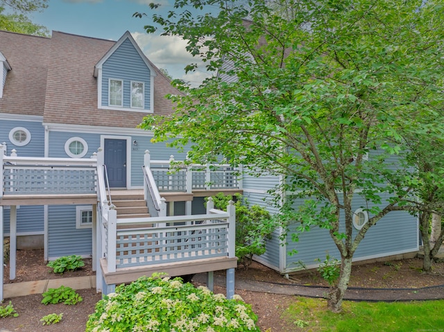 923 Old Pond Ln Unit 923, Norwich, CT 06360 - back of property featuring a wooden deck, a shingled roof, and stairs