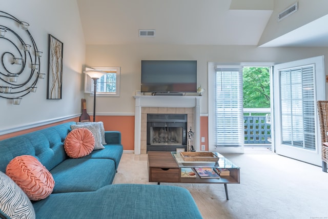 923 Old Pond Ln Unit 923, Norwich, CT 06360 - living room featuring vaulted ceiling, a fireplace, and carpet