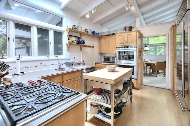 62 Wells Hill Rd, Weston, CT 06883 - kitchen with stainless steel appliances, rail lighting, light brown cabinets, light countertops, and backsplash