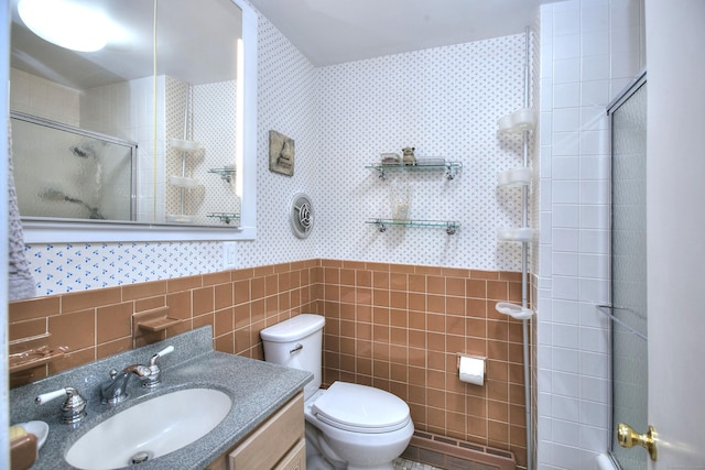 62 Wells Hill Rd, Weston, CT 06883 - bathroom with tile walls, wallpapered walls, tiled shower, vanity, and a wainscoted wall