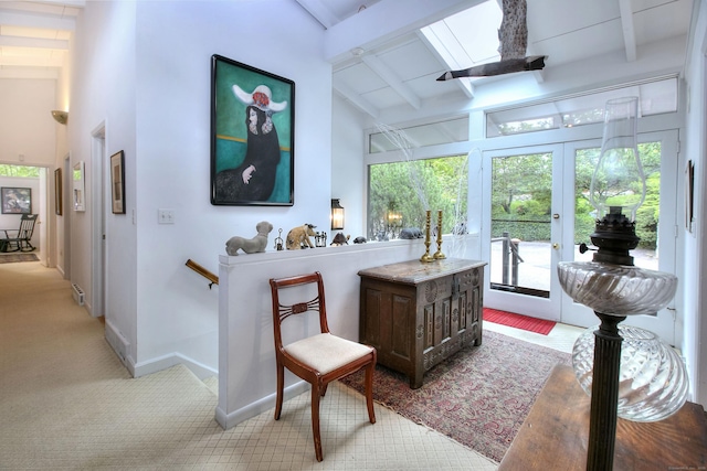 62 Wells Hill Rd, Weston, CT 06883 - interior space featuring light carpet, french doors, beamed ceiling, and a skylight