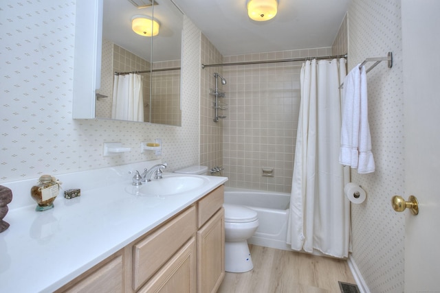62 Wells Hill Rd, Weston, CT 06883 - bathroom with wallpapered walls, vanity, wood finished floors, and shower / tub combo
