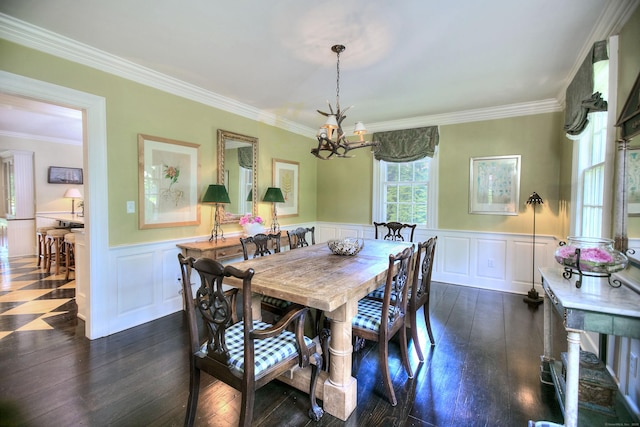 2683 Bronson Rd, Fairfield, CT 06824 - dining area featuring a chandelier, a decorative wall, ornamental molding, a wainscoted wall, and dark wood finished floors