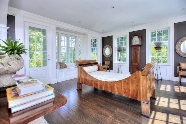 2683 Bronson Rd, Fairfield, CT 06824 - living area featuring dark wood-type flooring, crown molding, and healthy amount of natural light