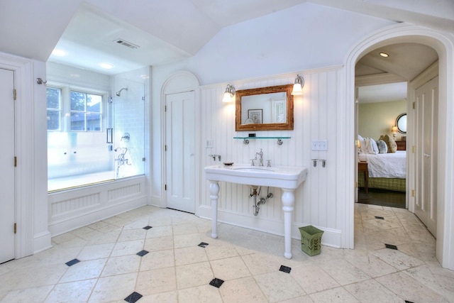 2683 Bronson Rd, Fairfield, CT 06824 - bathroom with ensuite bathroom, tub / shower combination, and tile patterned floors