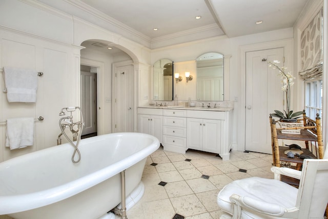 2683 Bronson Rd, Fairfield, CT 06824 - bathroom featuring double vanity, a freestanding bath, tile patterned floors, and crown molding