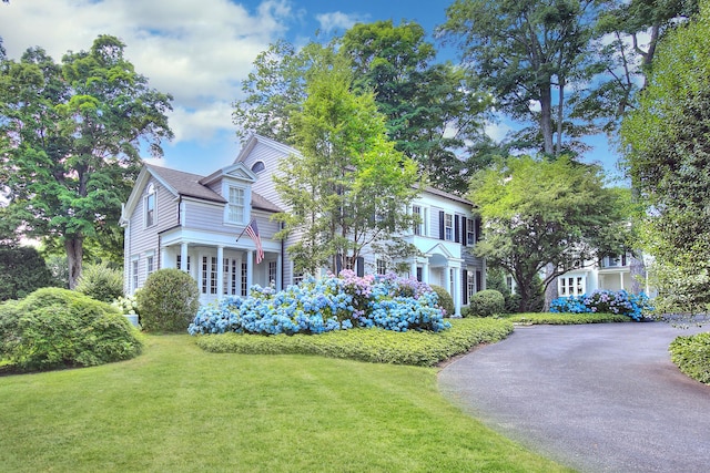 2683 Bronson Rd, Fairfield, CT 06824 - view of front of house featuring a front lawn and asphalt driveway