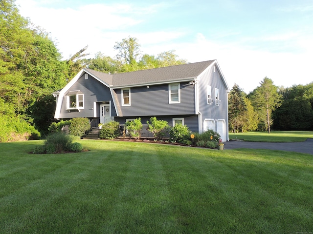 175 Cross Hill Rd, Monroe, CT 06468 - split foyer home with driveway, an attached garage, and a front lawn