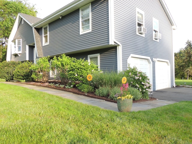 175 Cross Hill Rd, Monroe, CT 06468 - view of home's exterior featuring an attached garage, a lawn, and asphalt driveway