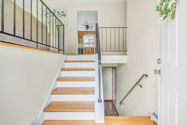 175 Cross Hill Rd, Monroe, CT 06468 - stairs featuring a baseboard heating unit, ceiling fan, and wood finished floors