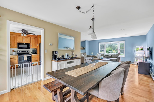 175 Cross Hill Rd, Monroe, CT 06468 - dining room with light wood-style floors, a ceiling fan, and baseboards